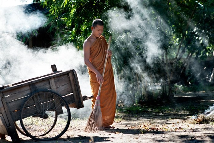 Tips For Travel Photography etiquette in Thailand. Buddhist Monk Sweeping