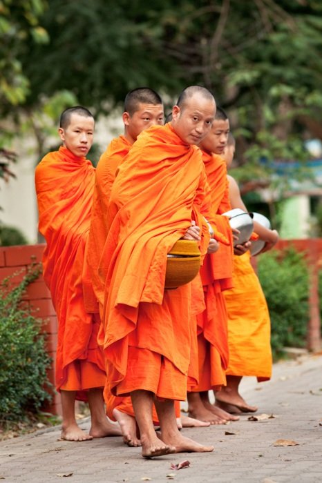 Tips For Travel Photography etiquette in Thailand. Buddhist Monks Receive Offerings