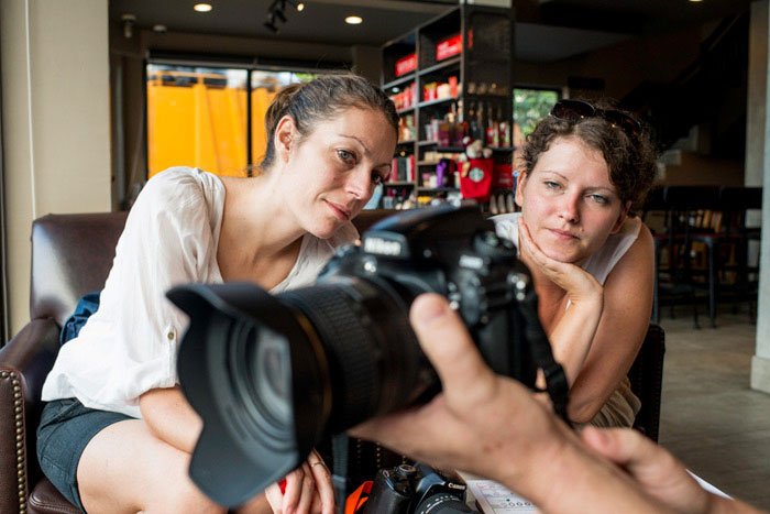 Two young woman and a DLSR camera during a Chiang Mai Photography Workshop